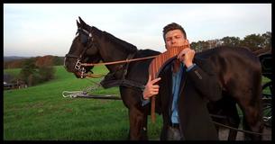 Man Standing Beside Horses Plays Pan Flute To His Chilling Version Of 'You Raise Me Up' Man Standing Beside Horses Plays Pan Flute To His Chilling Version Of 'You Raise Me Up'