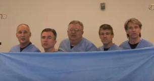 Team Of Doctors Hold Up A Sheet And Sing A Song That Has Everybody Cracking Up Team Of Doctors Hold Up A Sheet And Sing A Song That Has Everybody Cracking Up