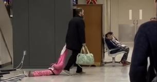 Frustrated Father Drags Daughter Through The Airport By Her Coat Hood Frustrated Father Drags Daughter Through The Airport By Her Coat Hood