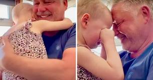 Après sept semaines de séparation, une petite fille de quatre ans qui lutte contre le cancer peut enfin embrasser son père Après sept semaines de séparation, une petite fille de quatre ans qui lutte contre le cancer peut enfin embrasser son père