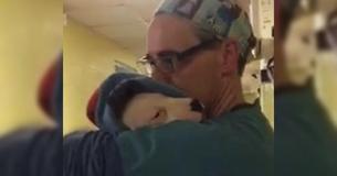 Vet Cradles Scared Rescue Puppy Like A Baby After Surgery Vet Cradles Scared Rescue Puppy Like A Baby After Surgery