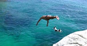 Jack Russell Diving Dog Leaps From Rocks With Her Owner Jack Russell Diving Dog Leaps From Rocks With Her Owner