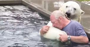 Man Swims Together With White Polar Bear He Has Raised For More Than Two Decades Man Swims Together With White Polar Bear He Has Raised For More Than Two Decades