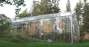 Couple Stays Warm And Grows Food Thanks To Greenhouse They Built Around Their Home Couple Stays Warm And Grows Food Thanks To Greenhouse They Built Around Their Home