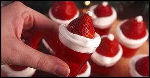 These Santa Hat Jell-O Shots Could Land You On Santa's Naughty List These Santa Hat Jell-O Shots Could Land You On Santa's Naughty List